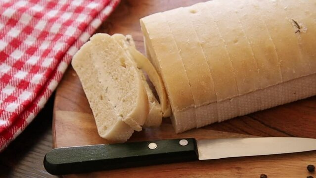 bread topped with garlic on a wooden board
