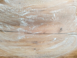 White flour on wooden table. Free space for text. View from above. Top view 