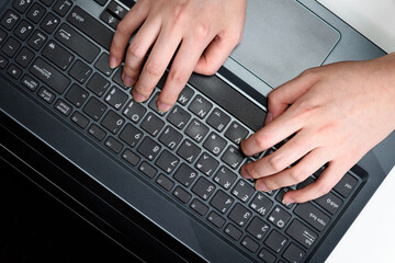 Fototapeta na wymiar an office worker who works hard on a laptop