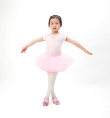 Fototapeta na wymiar The beautiful little girl is doing gymnastics on a white background