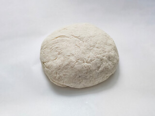 Fresh raw dough on white background. Top view. 