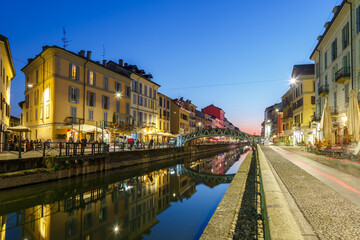 Fototapeta na wymiar Milan Navigli Milano restaurant and bar district travel traveling holidays vacation town blue hour in Italy
