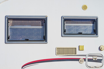 Details of camper, window with cover blind