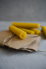 Candles made of natural honey wax. Craft envelopes for letters. Vertical photo.