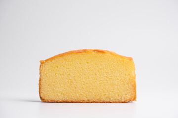 Fototapeta na wymiar Homemade butter cake slice on isolated white background