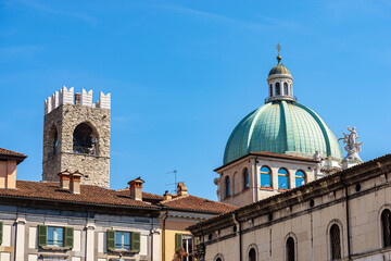 Brescia. New Cathedral of Santa Maria Assunta, 1604-1825 and medieval Tower of the Broletto Palace called Torre del Pegol or Torre del Mercato, XII-XIII century. Piazza della Loggia, Lombardy, Italy.