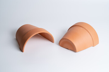 Broken terracotta pot on isolated white background. Manufactured defect. Shipment risk.