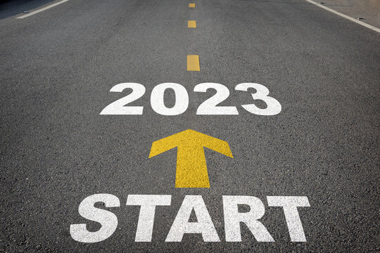 Start to 2023 written on the road background with yellow arrow. Business planning concept and new year beginning success idea