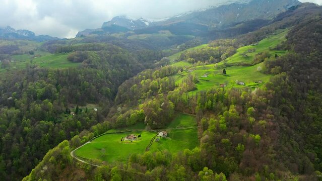 Aerial video of the small town of Pasturo in Lombardy, North Italy showing mountain panorama, forest and old cottages in the small village. Footage 4k, drone view