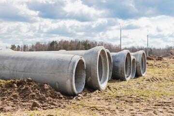 Water pipes for drinking water supply lie on the construction site. Preparation for earthworks for...