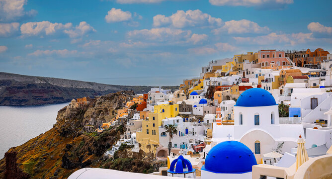 Panorama view  look out  with blue sky scene background  and blue dome church  at Oia village, Santorini,Greec
