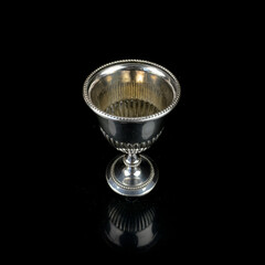 antique metal glass. antique silver glass for alcoholic beverages. engraved silver service on a...