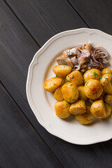 Fresh Cooked, new potatoes,with dill, on a wooden table, selective focus. close-up, toning, no people,