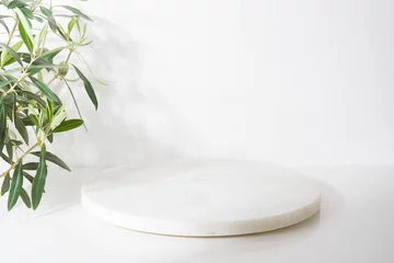 Gordijnen White marble podium for product presentation with olive tree leaves © didecs