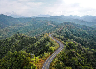 Fototapeta na wymiar Aerial view of Curvy road number 3 in the mountain of Pua district, Nan province, Thailand