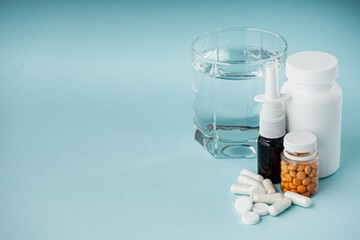 various medicines on a blue paper background