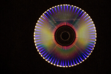 Reflection of light in a Compact Disk(CD) or Digital versatile disk(DVD).