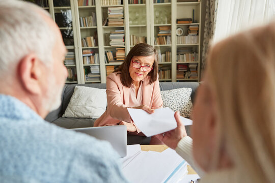 Financial advisor presents seniors with a contract