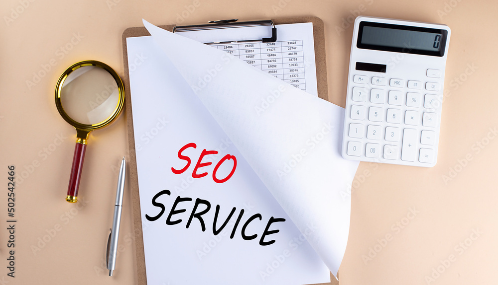 Poster clipboard with chart and text seo service with magnifier ,calculator on beige background