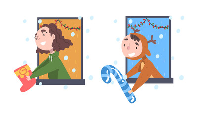 Cute Little Boy and Girl Looking out of Window Giving or Receiving Christmas Gift