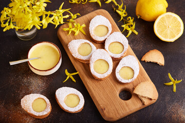 Linzer cookies in a shape of Easter eggs filled with lemon curd