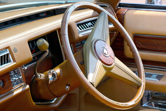 Wroclaw, Poland, August 22, 2021: Wooden steering wheel of an old Chrysler car.