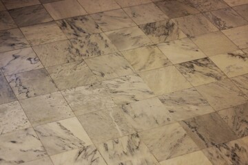 Obraz premium Vintage marble floor made of square tiles.