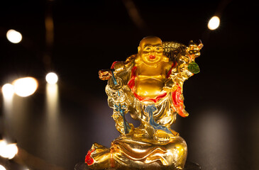 View of the laughing Buddha considered as a symbol of happiness, abundance, contentment and...