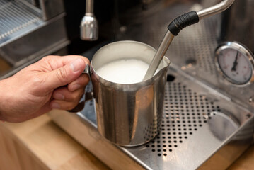 Fototapeta na wymiar heating the milk in a coffee machine