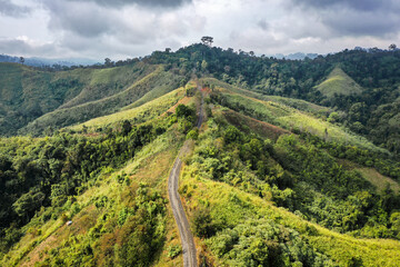 Fototapeta na wymiar Aerial view of Curvy road number 3 in the mountain of Pua district, Nan province, Thailand