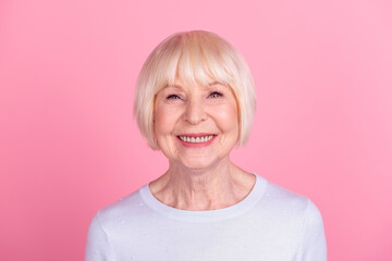 Photo of senior cheerful woman toothy smile visit dentist clinic oral care implants isolated over pink color background