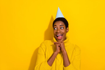 Photo of trans girl look empty space wear cone headwear celebrate birthday party isolated on yellow...