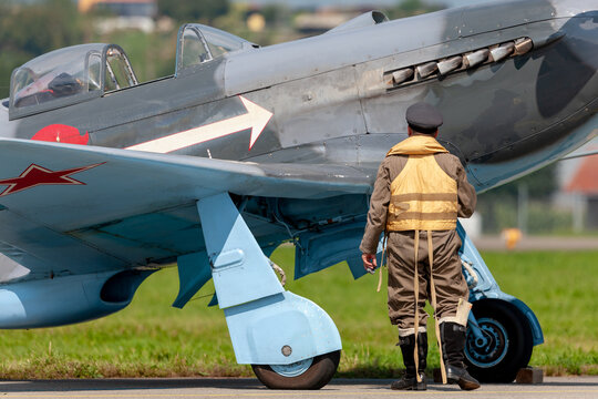 Payerne, Switzerland - September 7, 2014: Yakovlev Yak-3M World War II fighter aircraft D-FYGJ with a pilot dressed in period uniform.