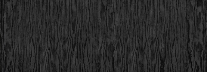 Black wood grain wide panoramic texture. Dark gray plywood large long backdrop. Wooden surface...