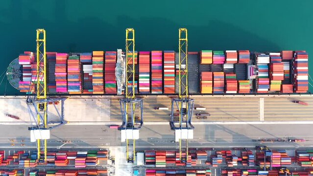Aerial view from drone of Container , container ship in export and import business and logistics. Shipping cargo to harbor,global transportation and logistic business. Oversea international Business.