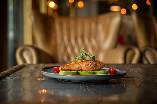 Grilled salmon steak with zucchini and creamy sauce