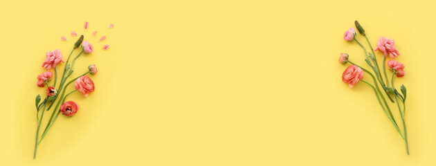 Top view image of pink flowers composition over yellow background