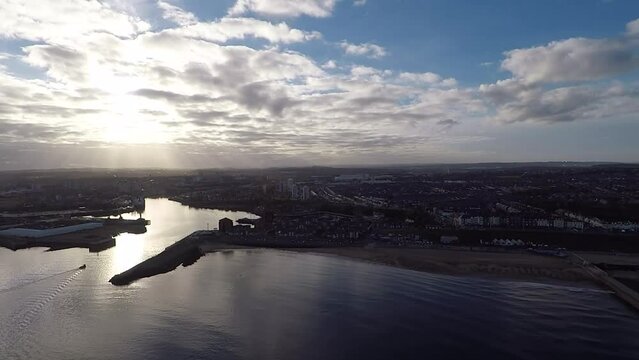 The mouth of the River Wear and coastline on a late afternoon, Sunderland, England. Aerial Drone Shot
