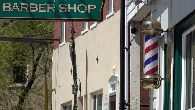 Barber shop sign and revolving barber pole.