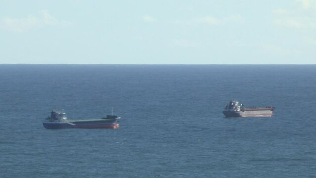 Image of two shipping vessels, atlantic ocean.