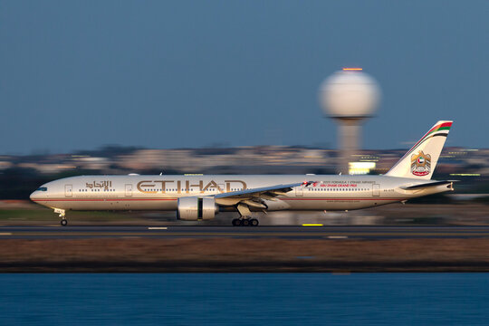 Sydney, Australia - October 9, 2013: Etihad Airways Boeing 777 landing at Sydney Airport just after sunset.