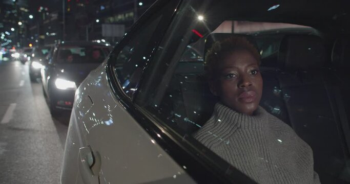 Young Black Woman Passenger Stands At The Traffic Lights In The Night In A Big City Inside A Taxi