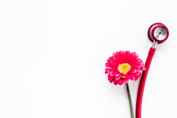 Breast cancer and women health background with red flower