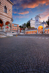 Udine, Italy. Cityscape image of downtown Udine, Italy with town square at sunrise.