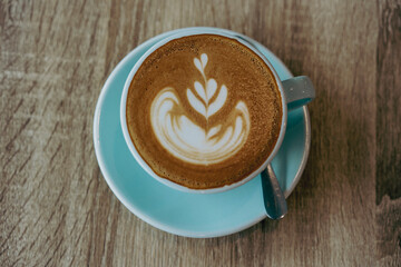 top view of latte coffee on wooden table