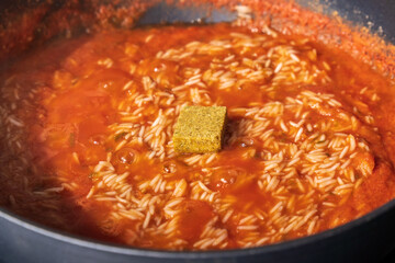 Jollof rice, west african cuisine. West African countries, cooking food. Selective focus