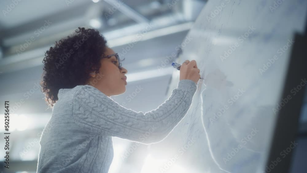 Poster Black Female Scientist Solving Problems and Math Equation while Using Whiteboard. Genius, Conceptuality and Breakthrough in Science Concept