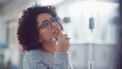 Black Female Young Genius Solves Complex Mathematical Problems while Write at the Whiteboard. Education and Conceptuality Concept. Portrait View - Powered by Adobe