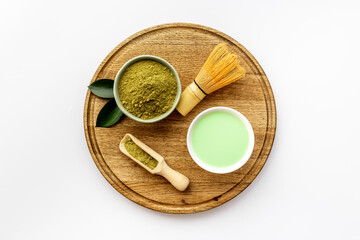 Green hot tea in bowls with matcha powder, top view