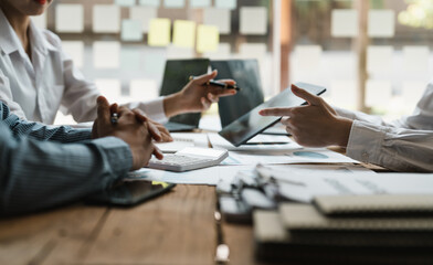 Business people are meeting for analysis data figures to plan business strategies. Business...